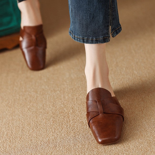 Women's square-toe cross-strap leather mules shown as a pair