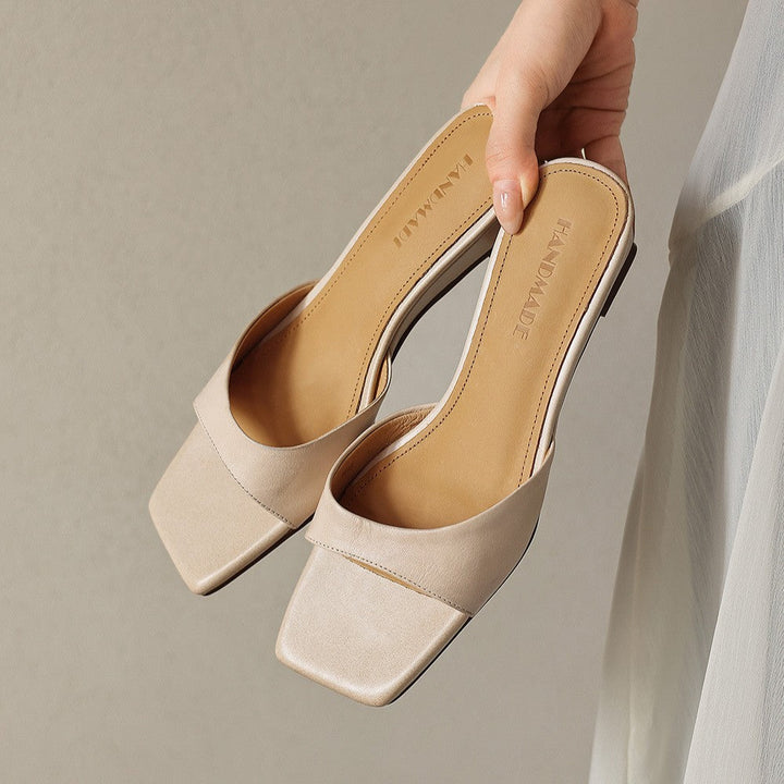 Classic Black Bernadette mules photographed from above