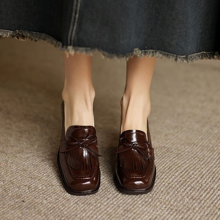 Patent Black leather loafer pump, side view of block heel