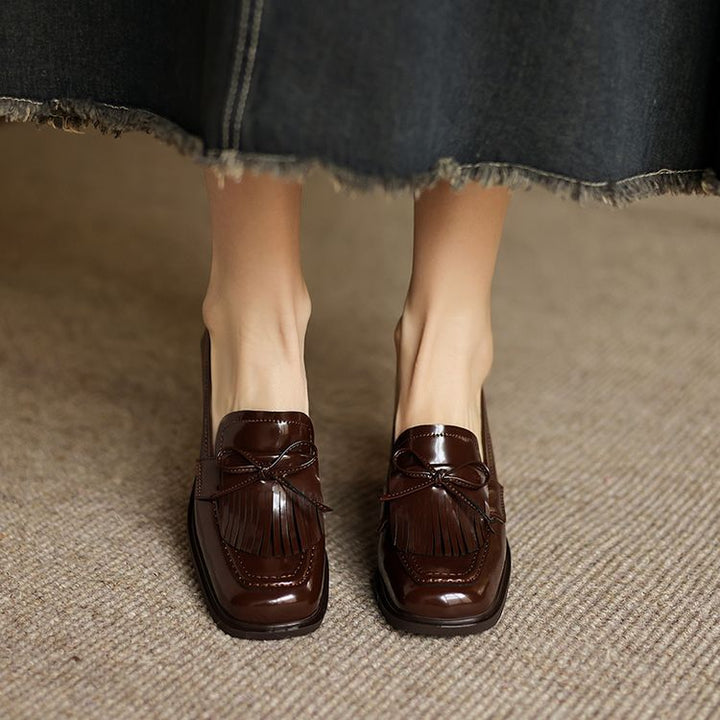 Patent Black leather loafer pump, side view of block heel