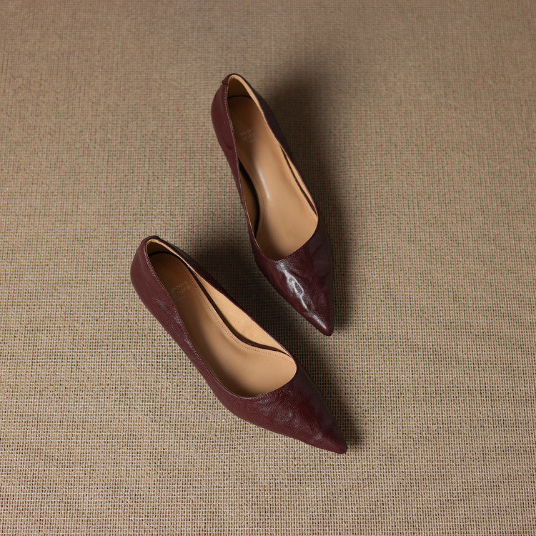 Pointed leather low pumps styled with a midi dress
