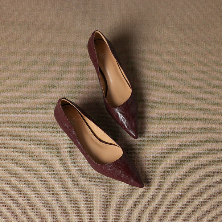 Pointed leather low pumps styled with a midi dress