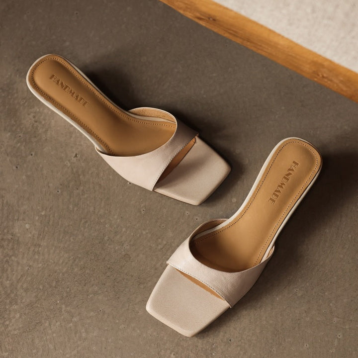 Warm Ochre Bernadette wedge mules styled for summer