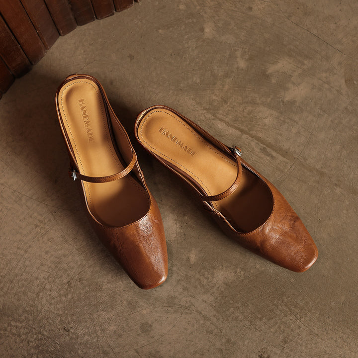 Top-down view of a square-toe leather heeled mule