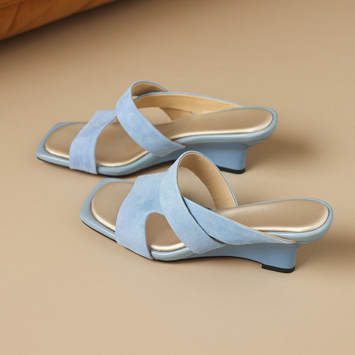 Sole and wedge detail of Marguerite suede mules