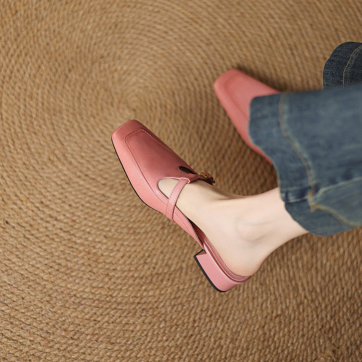 Ivory Sand leather mule, side view of low sculpted heel