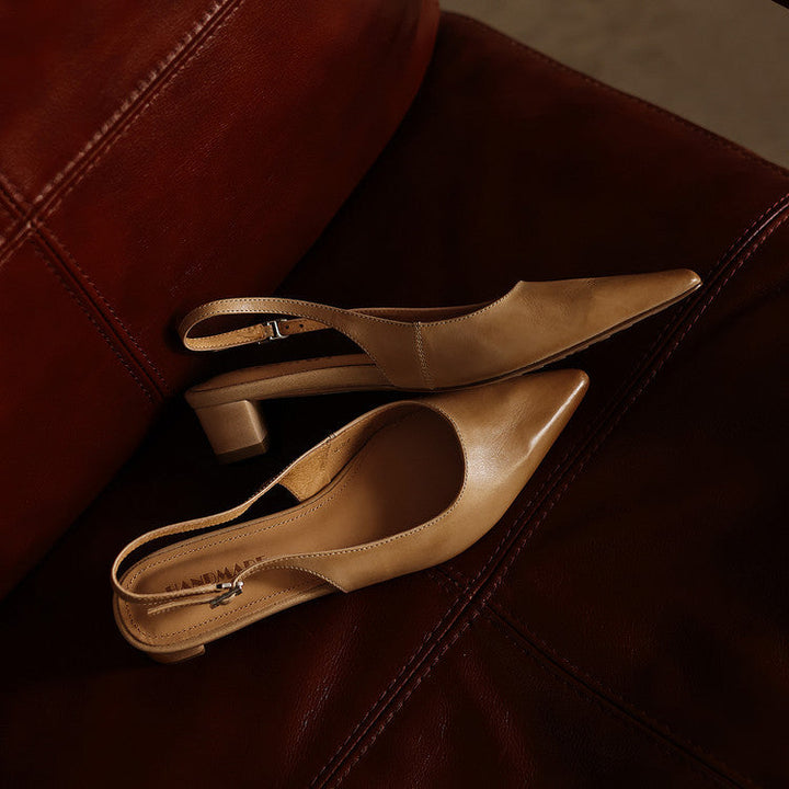 Women's pointed leather slingback heels shown as a pair