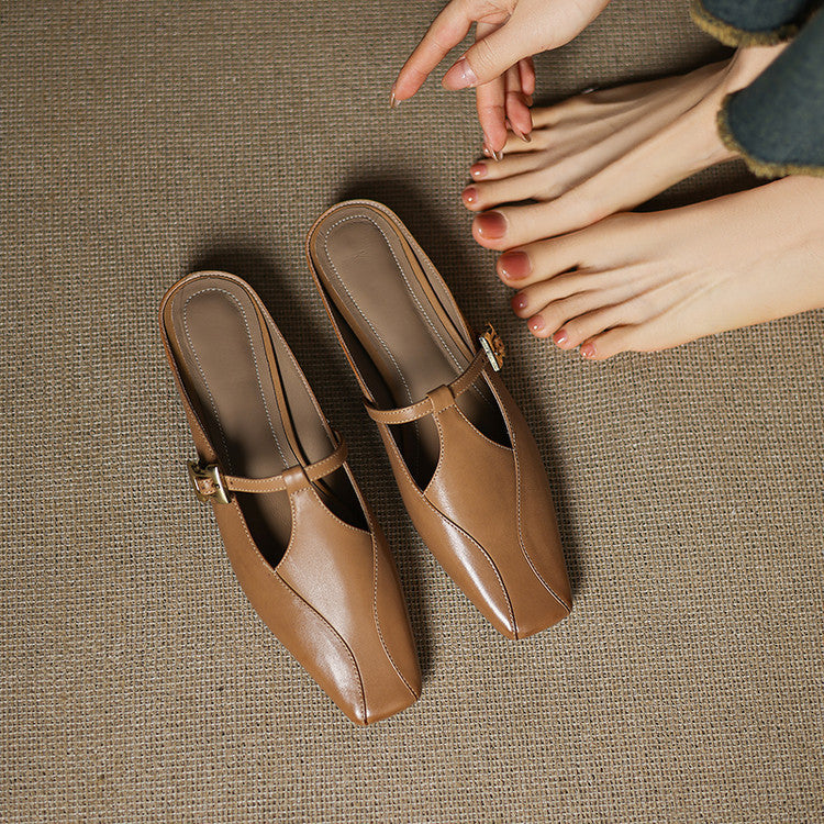 Onyx Black leather heeled mules, angled studio shot