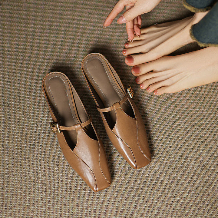 Onyx Black leather heeled mules, angled studio shot