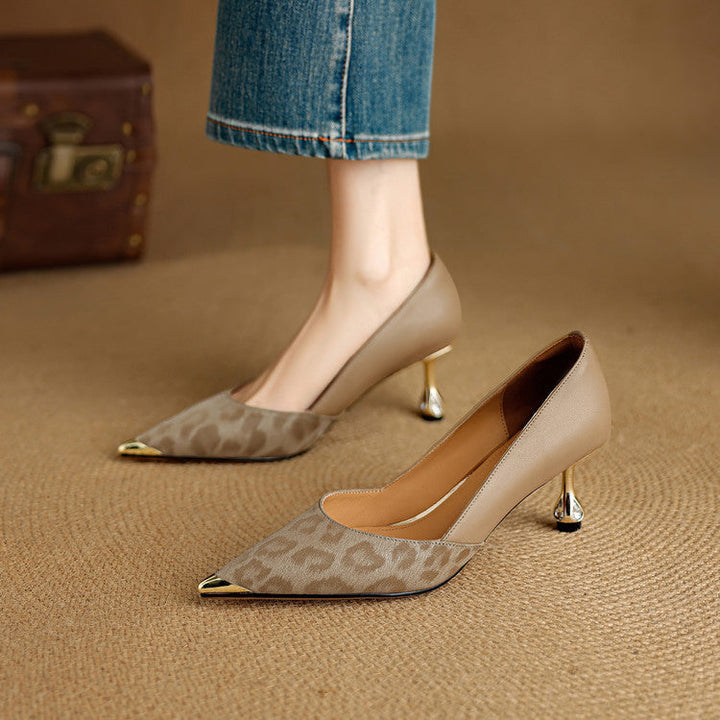 Close-up of metallic heel on Vanessa leather pumps