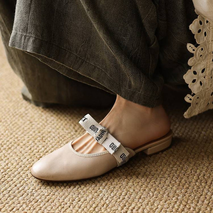 Burgundy Wine leather bow mules, angled studio shot