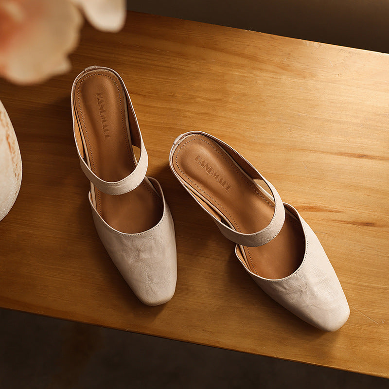 Cushioned insole and rubber sole of a leather wedge mule