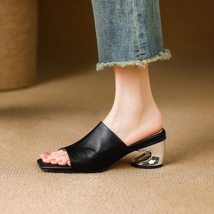 Camilla mules, front view in Obsidian Black