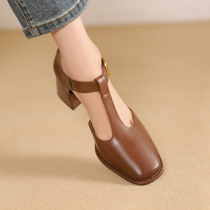 Close-up of block heel on Vera leather pumps