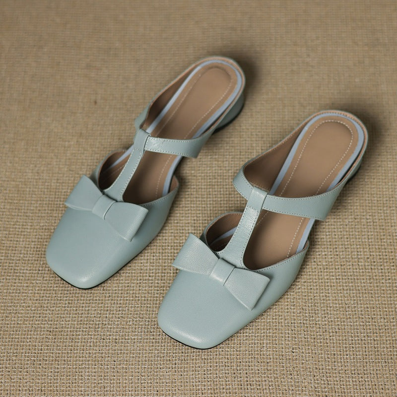 Soft Ivory Penelope mules photographed from above