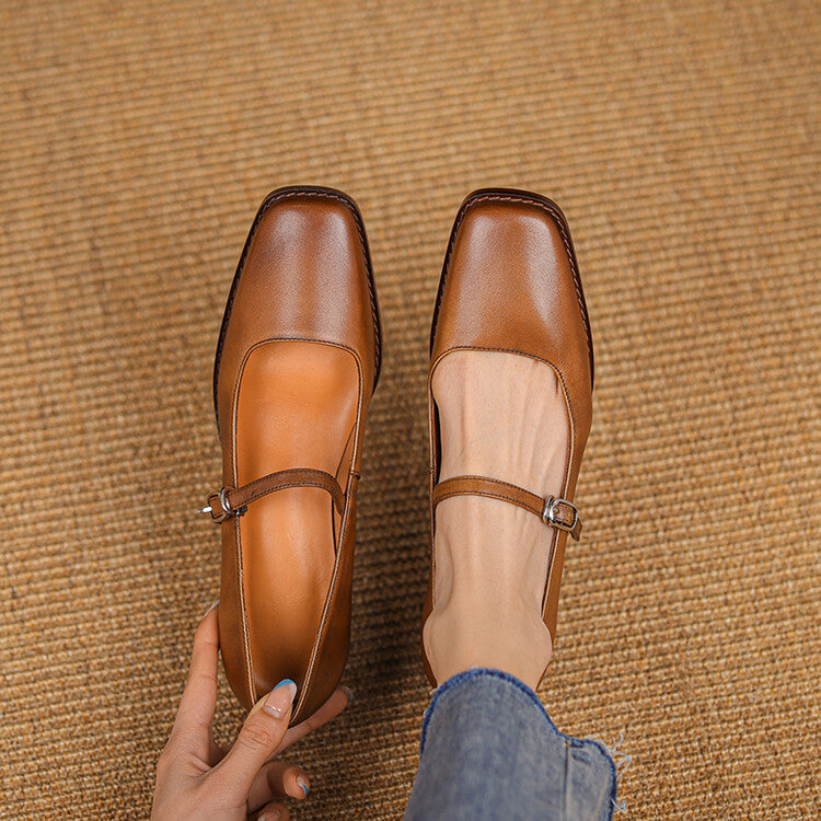 Leather Mary-Jane heels styled with a midi skirt
