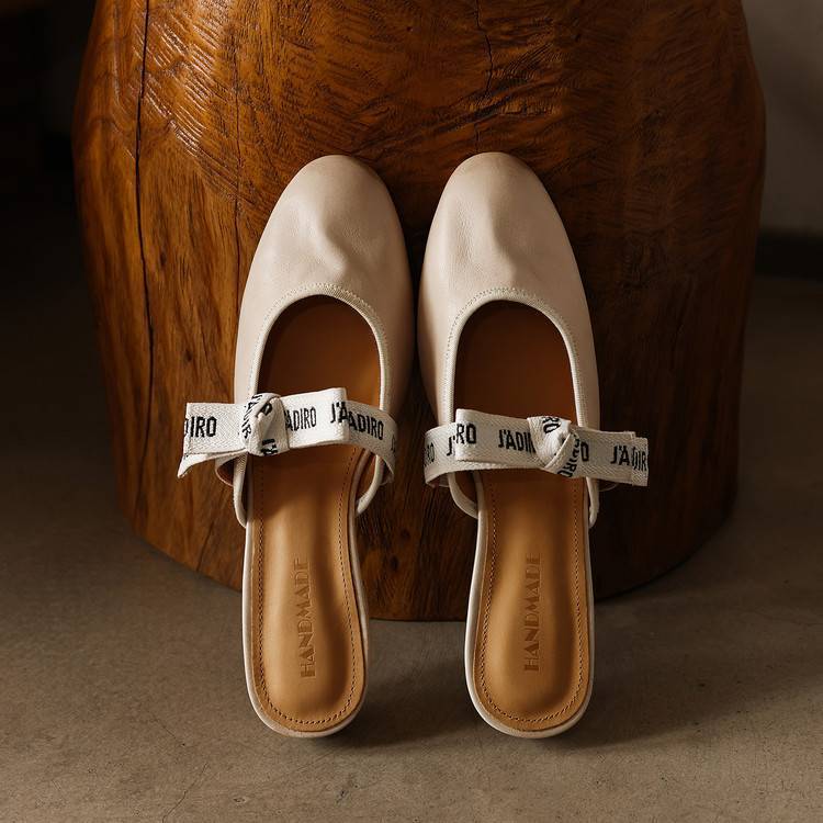 Caramel Tan Adele bow mules styled for the office