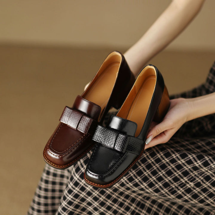Textured bow detail on a leather loafer pump