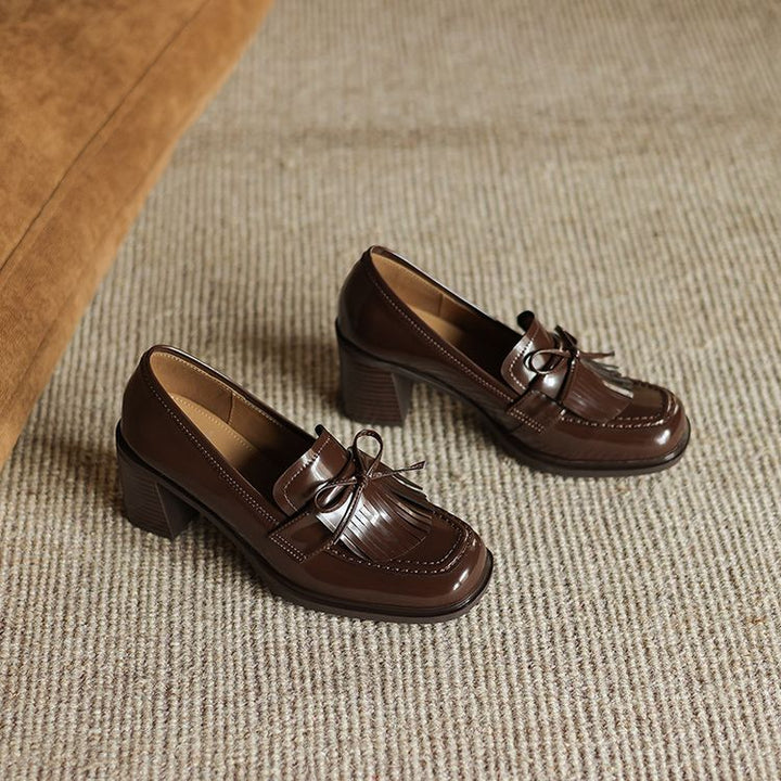 Fringe leather loafer pumps, top view of Espresso Brown pair