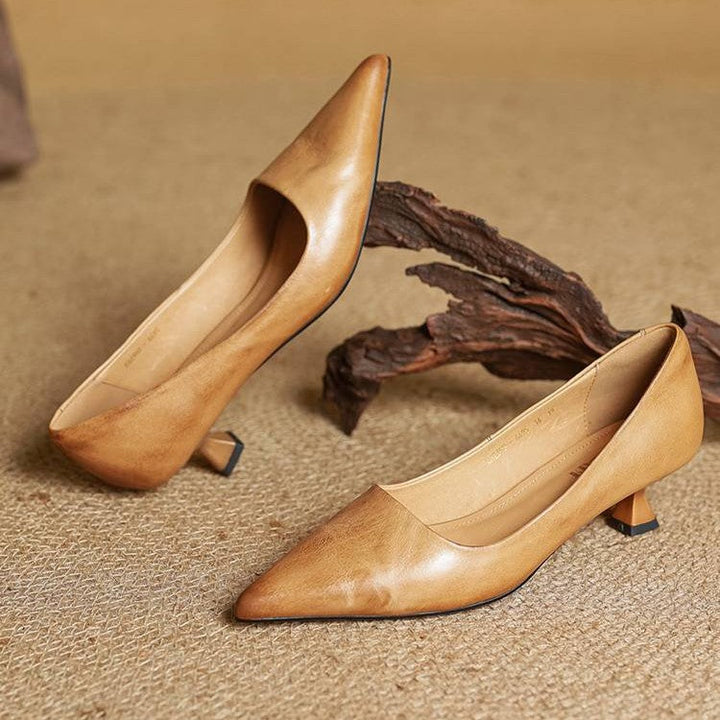 Top-down view of a pointed-toe leather kitten heel