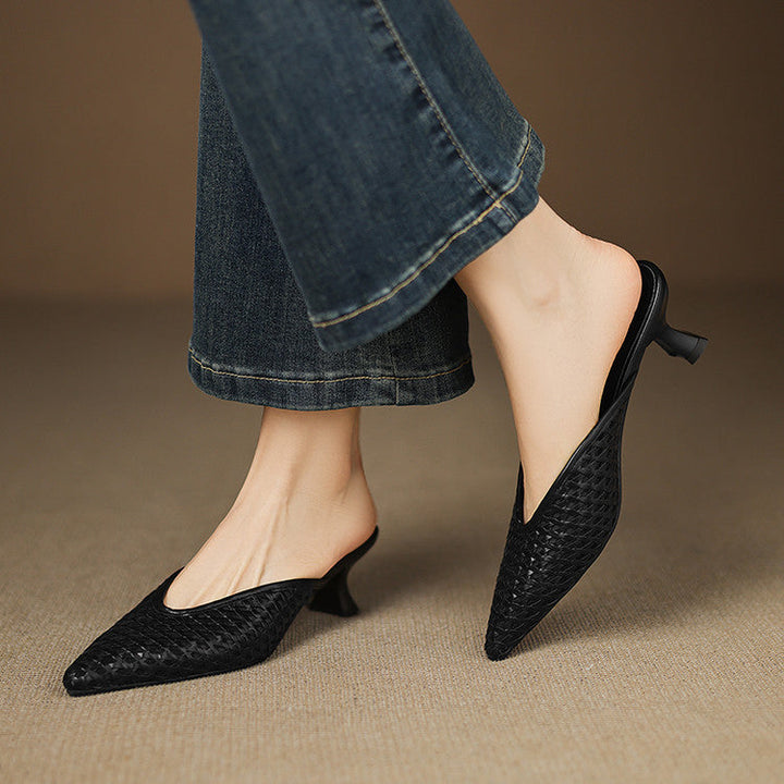 Women's woven leather heeled mules shown as a pair