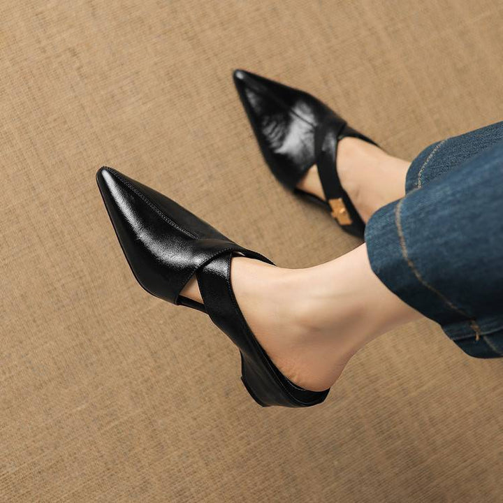 Refined metal accent detail on a leather mule