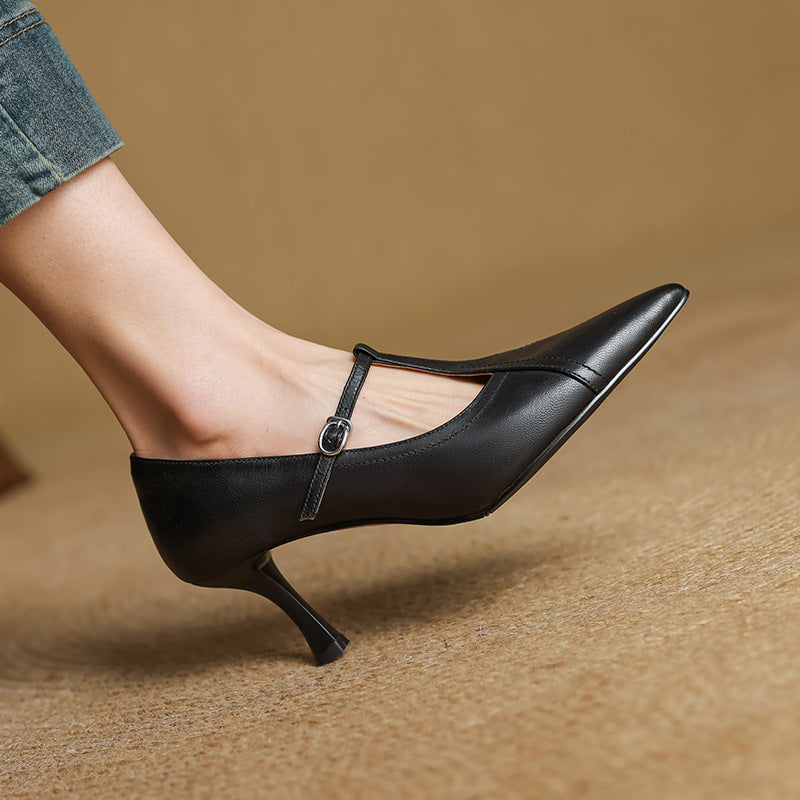 Close-up of heel on Evelyn leather T-strap pumps