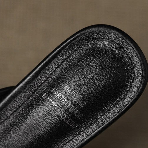 Open-weave leather detail on a heeled mule