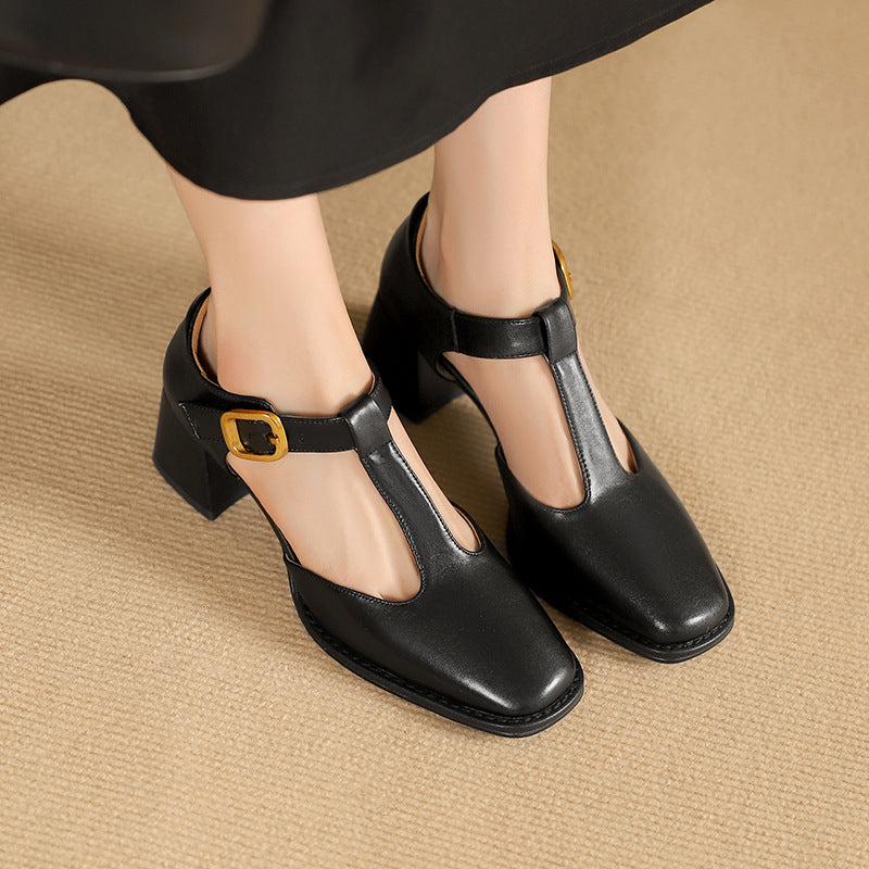Onyx Noir leather T-strap pump with buckle, three-quarter view
