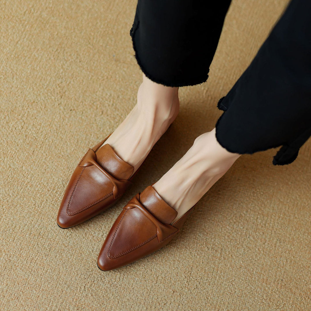 Close-up of genuine leather and folded vamp on a pointed mule