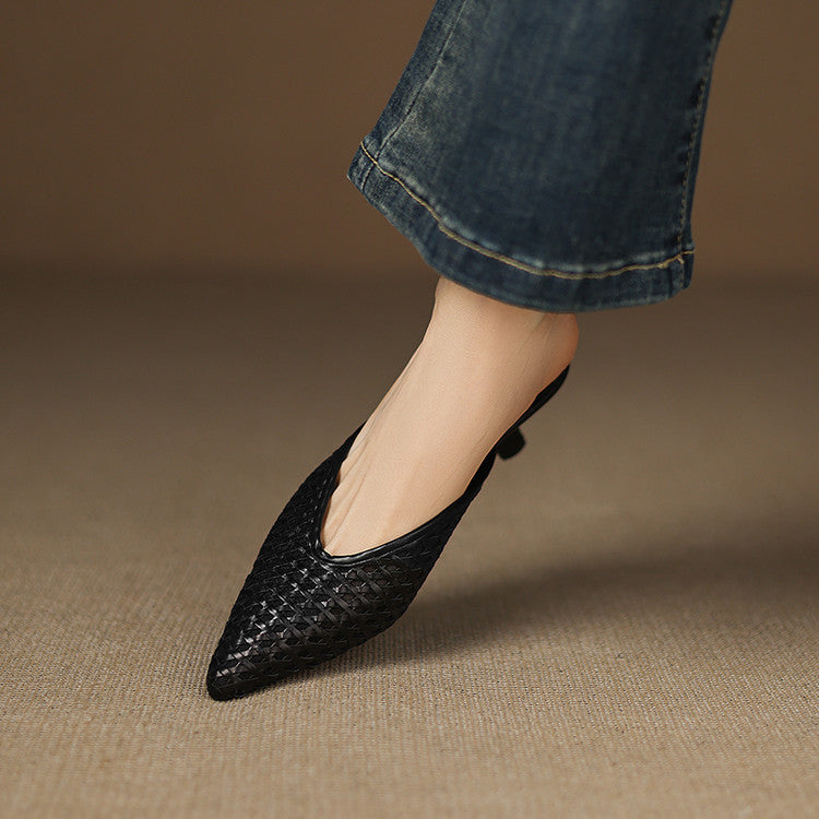 Woven leather mules styled with linen trousers