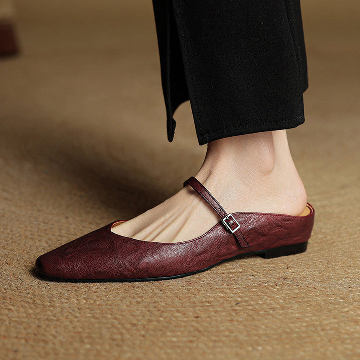 Sand Beige Rosalyn flat mules styled with denim