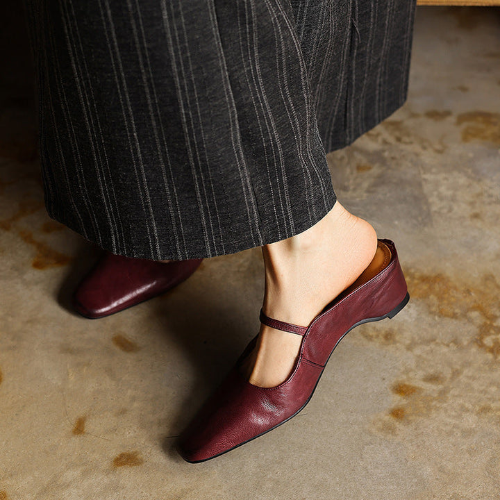 Adjustable strap detail on a square-toe leather mule