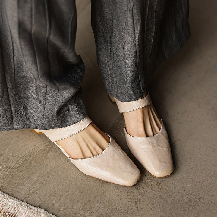 Close-up of supple lambskin leather on a square-toe wedge mule
