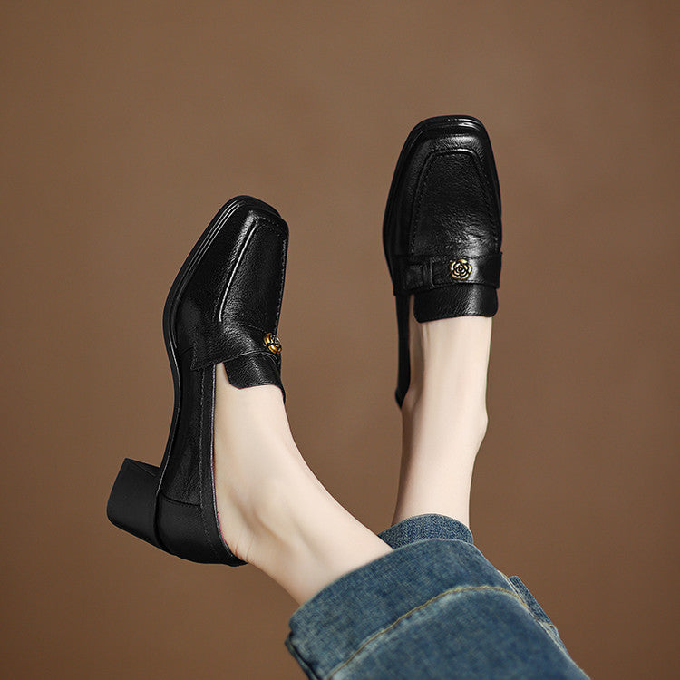 Close-up of block heel on Sylvie leather loafer pumps