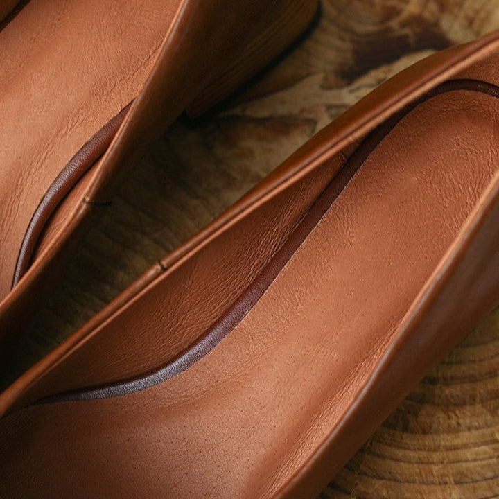Square-toe leather low pumps styled with trousers