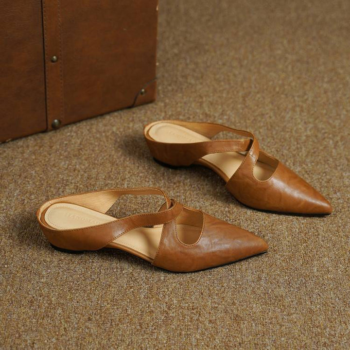 Women's cross-strap leather mules shown as a pair