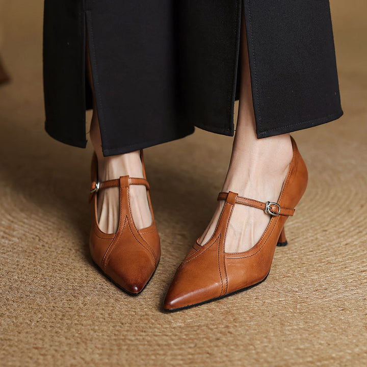 Timeless Black leather T-strap pump, side view of 2.75-inch heel