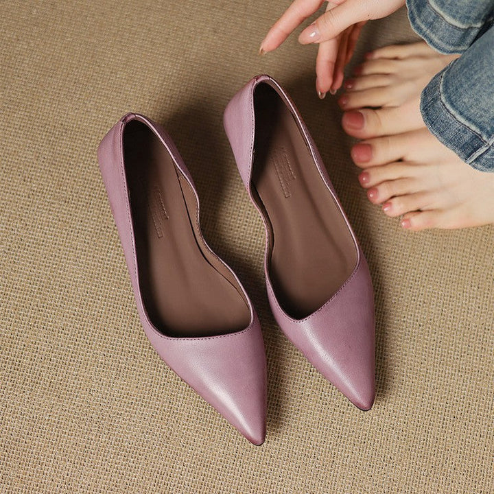 Top-down view of a pointed-toe leather kitten heel pump