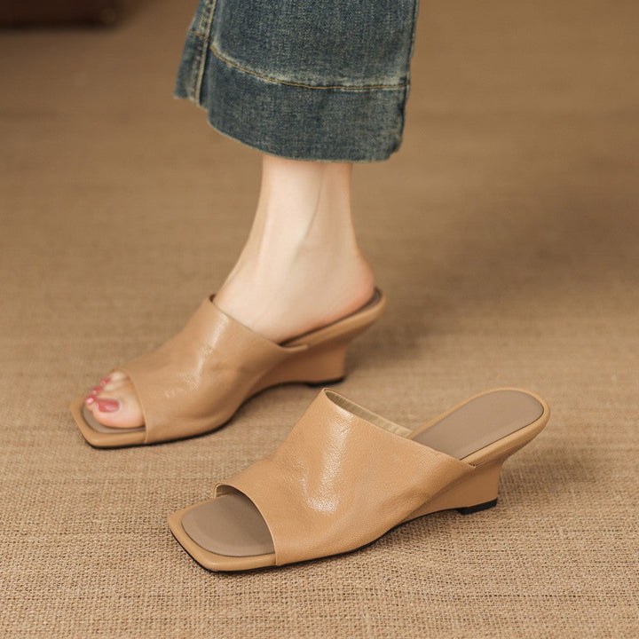 Gloria wedge mules worn with linen trousers