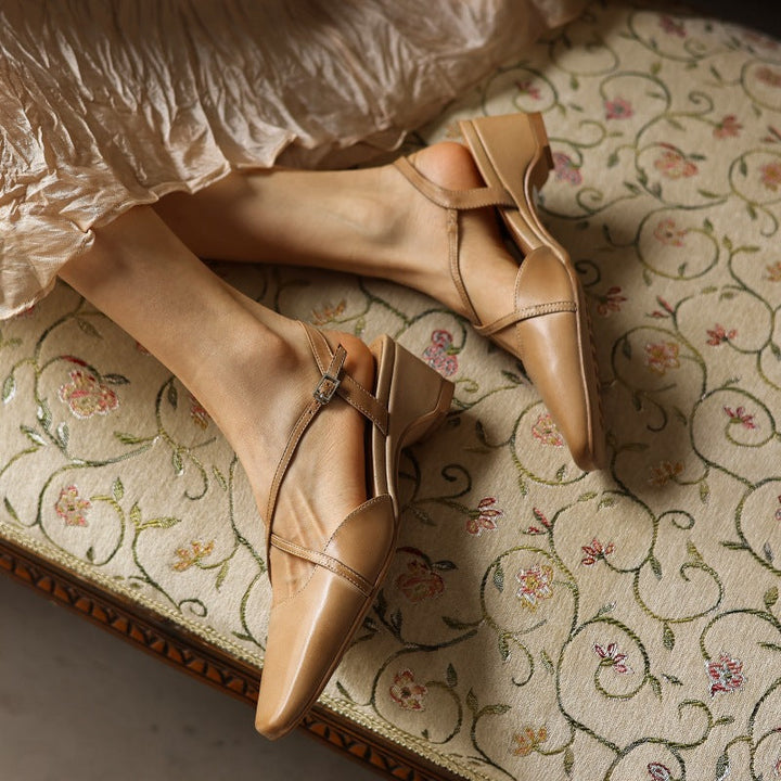 Cross-strap leather slingback, angled 1.75-inch block-heel view