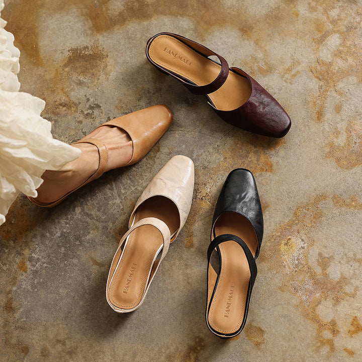 Women's slip-on leather wedge mule, angled heel view