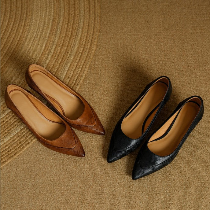 Women's pointed leather heels shown as a pair