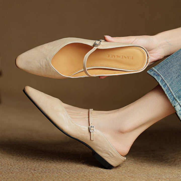 Sand Beige lambskin flat mule with round toe, three-quarter view