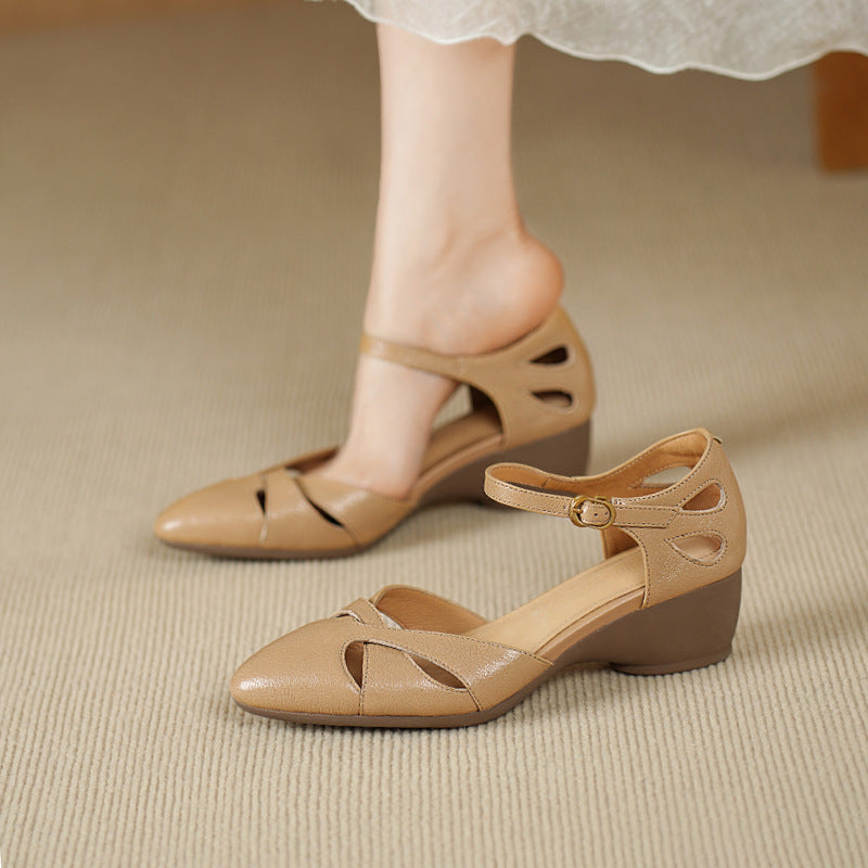 Warm Sand lambskin cutwork heels, angled studio shot