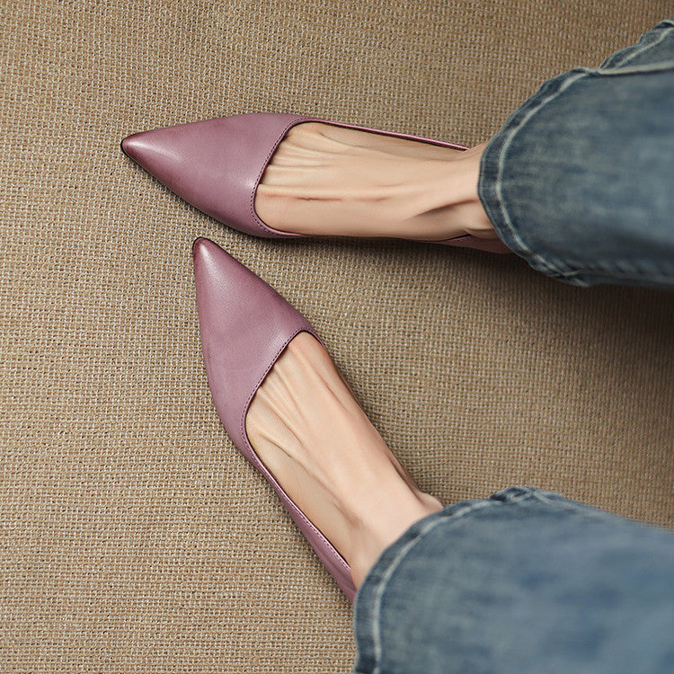 Close-up of cowhide leather on a pointed kitten heel pump