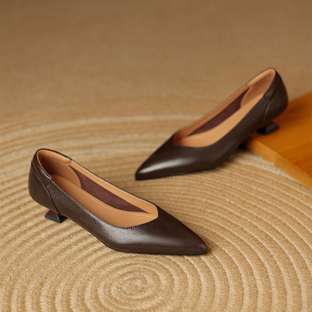 Women's pointed sculpted leather pumps, front view