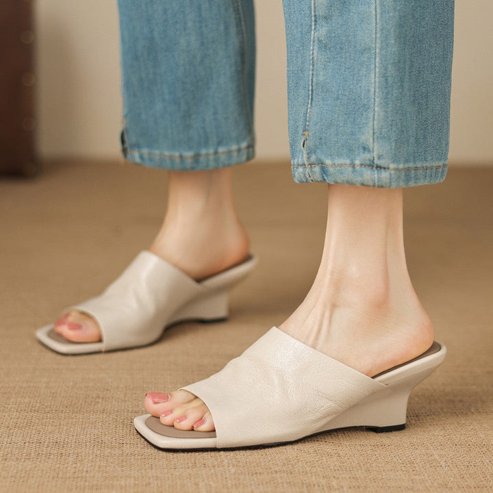 Soft Ivory lambskin wedge mule with square open toe, three-quarter view