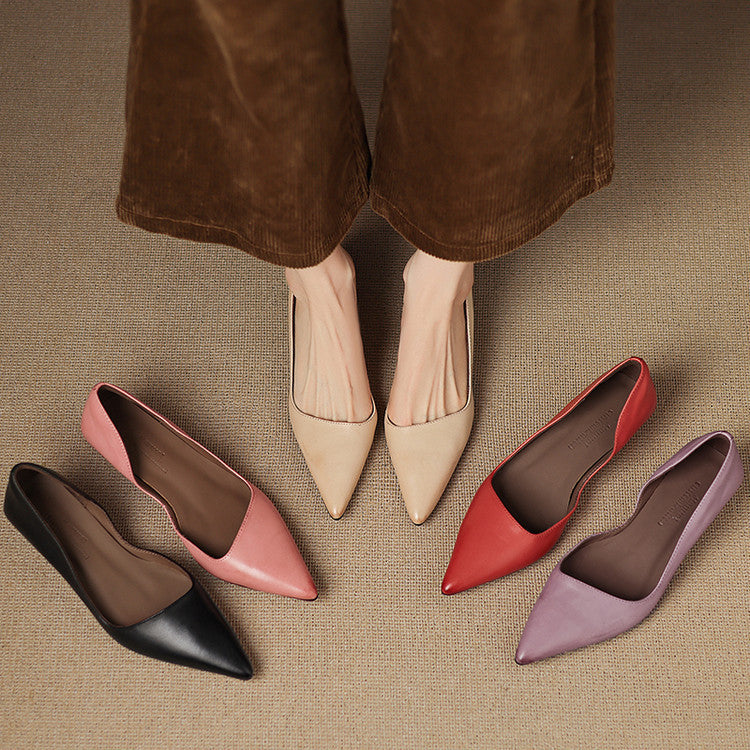 Women's leather kitten heel pumps shown as a pair