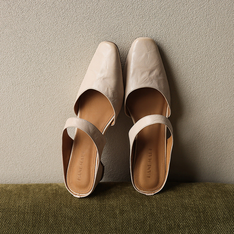 Square-toe leather wedge mules styled with cropped trousers